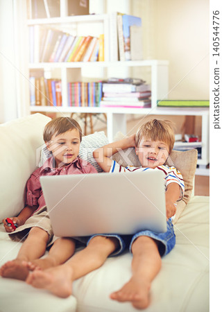 Laptop, relax and children on sofa in home, learning and family streaming cartoon on internet together. Computer, kids and boys in living room for education, movies or brothers with games in house Laptop, relax and children on sofa in home, learning and family streaming cartoon on internet together. Computer, kids and boys in living room for education, movies or brothers with games in house 140544776