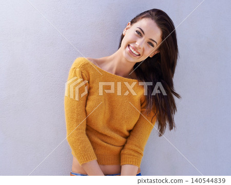 Portrait, fashion and smile of woman on a wall, model or girl in an outfit isolated on a purple background mockup space. Happy, face and person in casual clothes, trendy or stylish sweater in Italy Portrait, fashion and smile of woman on a wall, model or girl in an outfit isolated on a purple background mockup space. Happy, face and person in casual clothes, trendy or stylish sweater in Italy 140544839