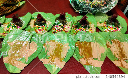 Freshly Prepared Paan Leaves with Colorful Toppings Freshly Prepared Paan Leaves with Colorful Toppings 140544894