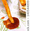Golden French Fries with Spicy Sauce Dip 140544899