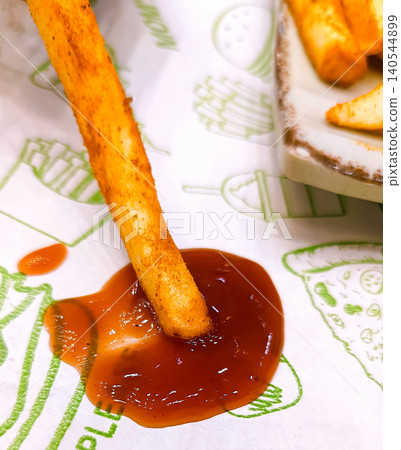 Golden French Fries with Spicy Sauce Dip 140544899