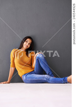 Portrait, woman and style on floor for leisure with casual outfit for fashion or comfort, relax and wellness with smile. Female person, isolated with grey background or wall for clothing with mockup. Portrait, woman and style on floor for leisure with casual outfit for fashion or comfort, relax and wellness with smile. Female person, isolated with grey background or wall for clothing with mockup. 140544926