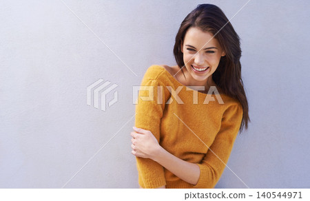 Woman, smile and mockup with fashion, laugh and smile with sweater for comfort. Model, happy and positive with natural, fun and confidence for funny joke or cool isolated on white wall background Woman, smile and mockup with fashion, laugh and smile with sweater for comfort. Model, happy and positive with natural, fun and confidence for funny joke or cool isolated on white wall background 140544971