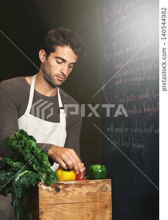 Chef, basket and business owner with vegetables or groceries in a bag for cooking or diet in kitchen. Man packing, shopkeeper and person sorting healthy food dinner or packaging box of ingredients 140544982