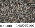 Fine gravel texture of a shrine; dense stone background material. 140545100