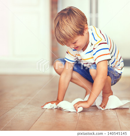 Boy, floor and cleaning in home for mess, spill or household chores for childhood development. Little boy, toilet paper and maintenance in house with hygiene, housework and learning responsibility Boy, floor and cleaning in home for mess, spill or household chores for childhood development. Little boy, toilet paper and maintenance in house with hygiene, housework and learning responsibility 140545145