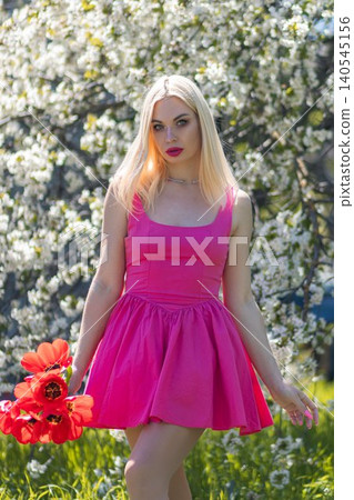 beautiful blonde in sundress on the meadow 140545156