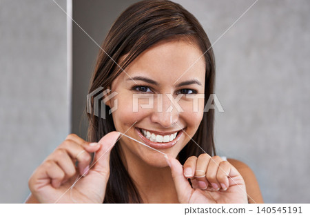 Floss, teeth and dental portrait of woman in morning, routine and grooming with self care in home. Cleaning, mouth and girl with healthy smile from oral flossing and treatment for fresh breath Floss, teeth and dental portrait of woman in morning, routine and grooming with self care in home. Cleaning, mouth and girl with healthy smile from oral flossing and treatment for fresh breath 140545191