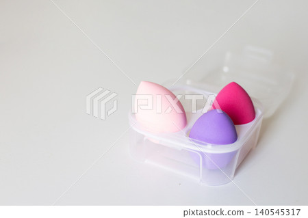 Colorful makeup sponges in travel case for beauty application Colorful makeup sponges in travel case for beauty application 140545317