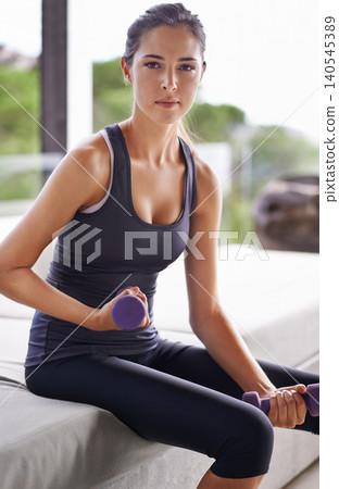 Fitness, dumbbells and portrait of woman for health, wellness and physical training in gym. Exercise, sitting and weights with young female person for workout, muscle gain or strength challenge Fitness, dumbbells and portrait of woman for health, wellness and physical training in gym. Exercise, sitting and weights with young female person for workout, muscle gain or strength challenge 140545389