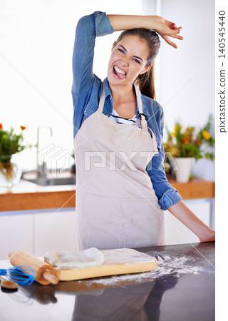 Portrait, baking and funny face with woman in kitchen of home for carefree or crazy fun with ingredients. Peace, recipe and stove with happy young baker person preparing pastry food in apartment Portrait, baking and funny face with woman in kitchen of home for carefree or crazy fun with ingredients. Peace, recipe and stove with happy young baker person preparing pastry food in apartment 140545440