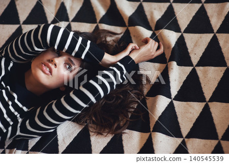 Woman, lying and carpet for thinking of fashion, stylish and clothing as minimalist aesthetic. Edgy, female person or planning of texture, pattern and design as contemporary fabric or textile idea Woman, lying and carpet for thinking of fashion, stylish and clothing as minimalist aesthetic. Edgy, female person or planning of texture, pattern and design as contemporary fabric or textile idea 140545539