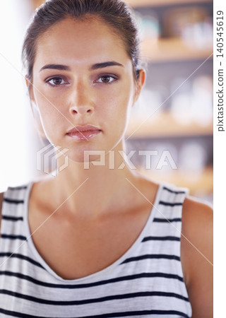 Portrait, home and fashion with woman, casual outfit and stylish clothes with confidence in a living room. Face, person and apartment with sweater and comfortable in a lounge with serious lady Portrait, home and fashion with woman, casual outfit and stylish clothes with confidence in a living room. Face, person and apartment with sweater and comfortable in a lounge with serious lady 140545619