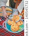 Pancakes are served with banitsa and pastry on table during Kazanluk Rose Festival food event in Bulgaria. Pancake recipe, bakery tradition, festival cuisine, community sharing 140545732