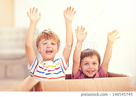 Children, box or portrait of siblings playing in house for fun, bonding or hands up game. Cardboard, learning and excited kids in living room for celebration, imagine or rollercoaster fantasy at home Children, box or portrait of siblings playing in house for fun, bonding or hands up game. Cardboard, learning and excited kids in living room for celebration, imagine or rollercoaster fantasy at home 140545745