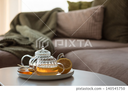 Herbal tea set with lemon and honey on coffee table Herbal tea set with lemon and honey on coffee table 140545750