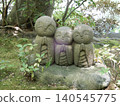A charming stone Jizo statue for finding love, smiling at a temple in Kamakura. 140545775