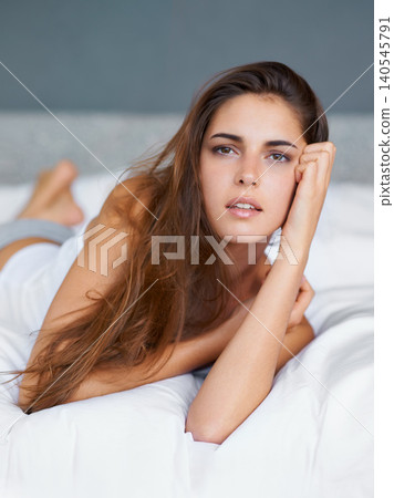 Confident, relax and portrait of woman in bed with wellness, morning and natural in apartment. Face, home and girl in bedroom with peace, calm and wake up for healthy sleep, comfort and weekend rest Confident, relax and portrait of woman in bed with wellness, morning and natural in apartment. Face, home and girl in bedroom with peace, calm and wake up for healthy sleep, comfort and weekend rest 140545791