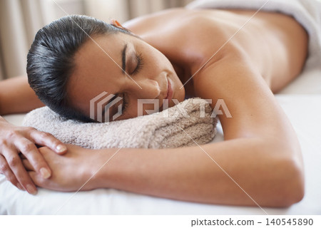 Relax, massage and woman at spa for peace, calm and skincare at luxury resort with eyes closed for wellness. Beauty, therapy or person at salon for body treatment, health or rest on table for service Relax, massage and woman at spa for peace, calm and skincare at luxury resort with eyes closed for wellness. Beauty, therapy or person at salon for body treatment, health or rest on table for service 140545890