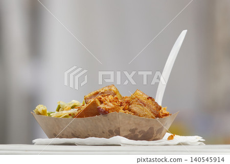 Asian street food pork belly in disposable paper tray at Prague Karlin Asian street food pork belly in disposable paper tray at Prague Karlin 140545914