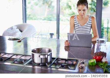 Woman, kitchen and laptop for food idea, female person and home on internet. Google it, browsing cooking recipes and social media, online search with technology or thinking of healthy meal to prepare Woman, kitchen and laptop for food idea, female person and home on internet. Google it, browsing cooking recipes and social media, online search with technology or thinking of healthy meal to prepare 140545959