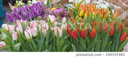 Dense mosaic of colorful fresh spring tulips floral background at Naplavka market 140545981