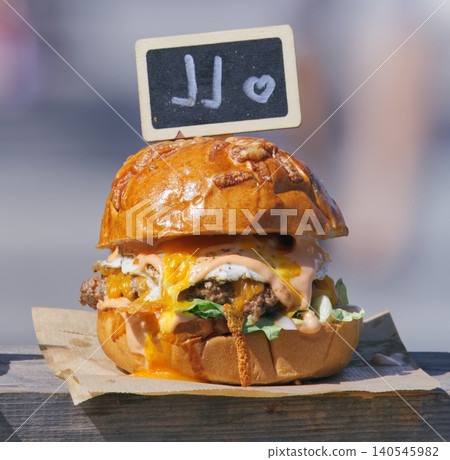 Delicious Street Food Burger With Runny Egag And Cheese 140545982