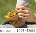 Eating Pulled Pork Loaded Fries At Street Food Festival 140545984