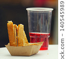 Toasted sandwich and red soda at street food festival in Karlin 140545989