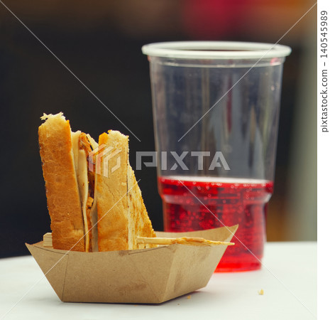 Toasted sandwich and red soda at street food festival in Karlin Toasted sandwich and red soda at street food festival in Karlin 140545989