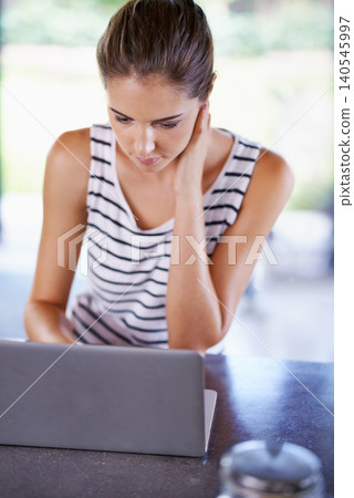 Reading, blog and woman in home with laptop for research and recipe for dinner. Online, thinking and person scroll on computer and learning from internet about information and streaming in kitchen 140545997