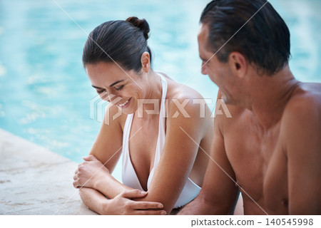Couple, pool and laugh on vacation, romance and commitment to funny conversation at hotel. Happy people, summer holiday and love or bonding in water, outdoor date and humor in communication at villa Couple, pool and laugh on vacation, romance and commitment to funny conversation at hotel. Happy people, summer holiday and love or bonding in water, outdoor date and humor in communication at villa 140545998