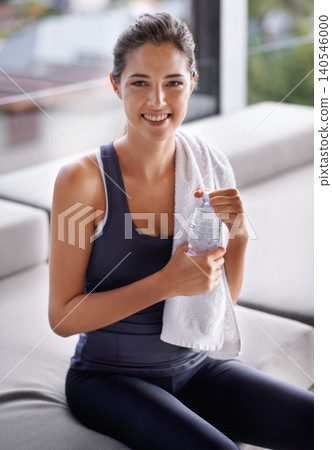Exercise, water and towel with portrait of woman at gym for health, wellness or workout. Fitness, smile and training with happy young athlete person satisfied in performance, progress or wellbeing Exercise, water and towel with portrait of woman at gym for health, wellness or workout. Fitness, smile and training with happy young athlete person satisfied in performance, progress or wellbeing 140546000