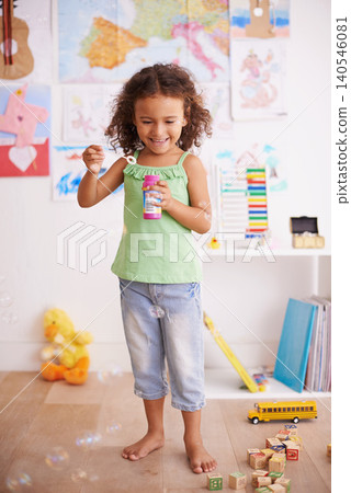 Playing, kid and blowing bubbles with toys for childhood development, smile and having fun alone. Happiness, growth and face of young girl in kindergarten for learning, soap liquid and games Playing, kid and blowing bubbles with toys for childhood development, smile and having fun alone. Happiness, growth and face of young girl in kindergarten for learning, soap liquid and games 140546081