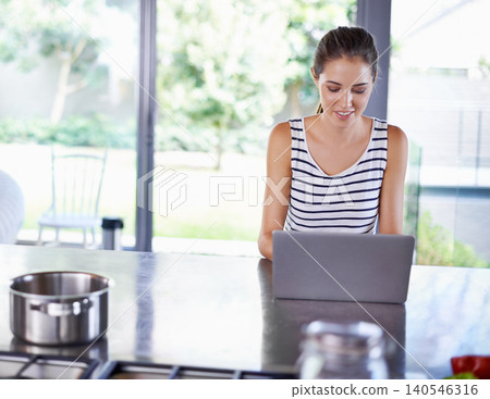 Online, search and woman in kitchen with laptop for cooking, research and recipe for dinner. Happy, chef and person typing on computer and learning from blog about nutrition, diet and information Online, search and woman in kitchen with laptop for cooking, research and recipe for dinner. Happy, chef and person typing on computer and learning from blog about nutrition, diet and information 140546316