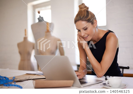 Designer, woman and phone call in workshop for fashion with laptop, happy and communication for deal. Person, smartphone and computer with conversation, negotiation or contact for material in studio Designer, woman and phone call in workshop for fashion with laptop, happy and communication for deal. Person, smartphone and computer with conversation, negotiation or contact for material in studio 140546325