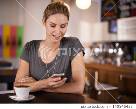 Happy woman, typing and phone with coffee at cafe for communication, social media or networking. Female person with smile on mobile smartphone for online chatting, texting or app at indoor restaurant Happy woman, typing and phone with coffee at cafe for communication, social media or networking. Female person with smile on mobile smartphone for online chatting, texting or app at indoor restaurant 140546482