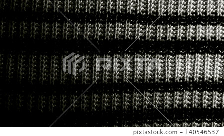 captivating macro closeup of black and white striped knitted fabric with intricate horizontal weave texture 140546537