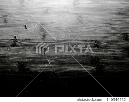 intense monochrome wooden plank texture displays horizontal grain scratch and embedded nail in dramatic chiaroscuro intense monochrome wooden plank texture displays horizontal grain scratch and embedded nail in dramatic chiaroscuro 140546552