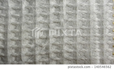 textured woven curtain fabric in soft neutral tones reveals elegant grid pattern with gold grommets textured woven curtain fabric in soft neutral tones reveals elegant grid pattern with gold grommets 140546562