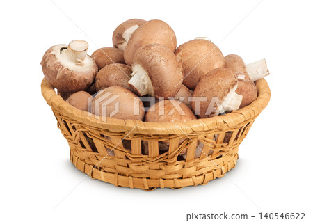 Brown champignon mushroom in a wicker basket isolated on white background Brown champignon mushroom in a wicker basket isolated on white background 140546622