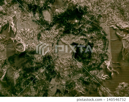 deconstructed textured fabric with messy fringed threads creates a dark mossy abstract background deconstructed textured fabric with messy fringed threads creates a dark mossy abstract background 140546732
