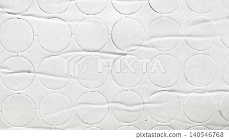 white textured paper background with embossed repetitive circle pattern and soft creased horizontal folds 140546768