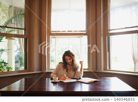 Books, remote work and woman writing in home office for idea inspiration, checklist or planner. Freelance, creative and female writer with pen for novel notes, reminder or planning business startup Books, remote work and woman writing in home office for idea inspiration, checklist or planner. Freelance, creative and female writer with pen for novel notes, reminder or planning business startup 140546833