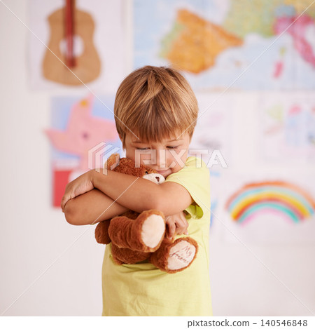 Child, boy and hug teddy bear, toys for safety and security in childhood with comfort and care in playroom. Peace, calm and affection with stuffed animal, soft and fluffy for love and youth at home Child, boy and hug teddy bear, toys for safety and security in childhood with comfort and care in playroom. Peace, calm and affection with stuffed animal, soft and fluffy for love and youth at home 140546848