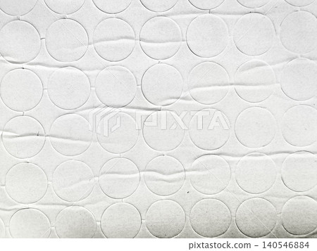 minimalist white textured paper background featuring rhythmic rows of circular die cut shapes creating geometric depth minimalist white textured paper background featuring rhythmic rows of circular die cut shapes creating geometric depth 140546884