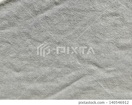 textured grey linen fabric background reveals natural woven cotton canvas fiber with soft organic creases textured grey linen fabric background reveals natural woven cotton canvas fiber with soft organic creases 140546912