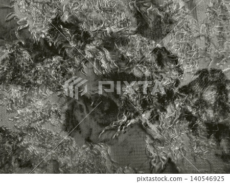 raw unspun wool roving creates abstract texture on sheer organic fabric in monochromatic minimalist flat lay raw unspun wool roving creates abstract texture on sheer organic fabric in monochromatic minimalist flat lay 140546925