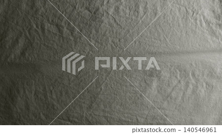 crumpled dark grey linen fabric texture showing organic creases and natural flax weave with moody dramatic lighting crumpled dark grey linen fabric texture showing organic creases and natural flax weave with moody dramatic lighting 140546961
