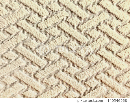 textured beige fabric background featuring raised geometric patterns of parallel lines and diamonds for home interior design textured beige fabric background featuring raised geometric patterns of parallel lines and diamonds for home interior design 140546968